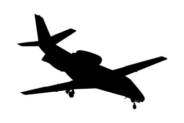 Silhouette of business airplane landing