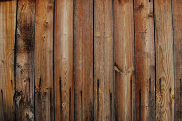Old weathered boards on the village fence
