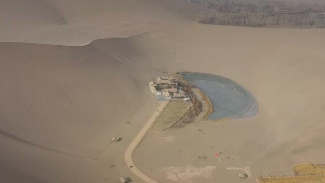 sunny day time desert dunes old town pond aerial panorama 4k gansu china