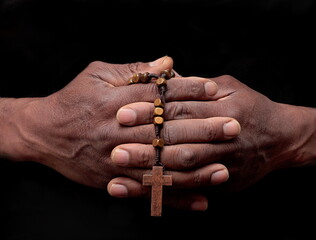 hand holding the Cross with black background stock photo