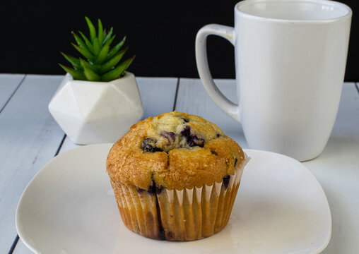 Fresh Baked Blue Berry Muffin With Coffee