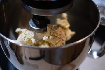 Fresh dough preparation. Making dough in a mixer.