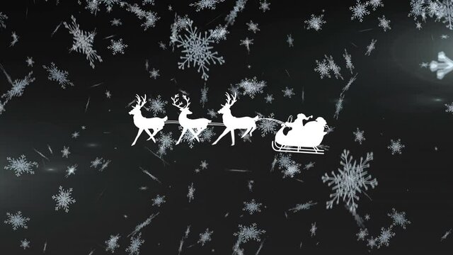 Santa claus in sleigh being pulled by reindeers over snowflakes falling against black background
