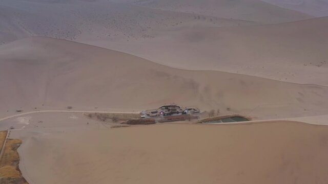 sunny evening time desert dunes old town pond aerial panorama 4k gansu china