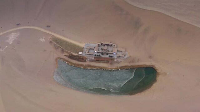 day time desert dunes old town pond aerial panorama 4k gansu china