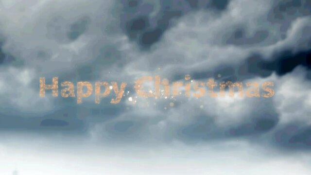 Happy christmas text over fireworks exploding against dark clouds in the sky