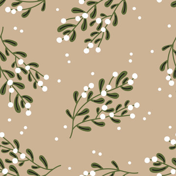 Christmas seamless pattern. Mistletoe on a beige background