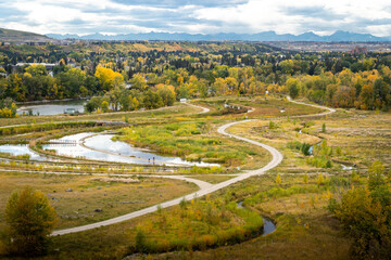 Dale Hodges Park and storm retention ponds during fall colours in Calgary Alberta Canada. - obrazy, fototapety, plakaty