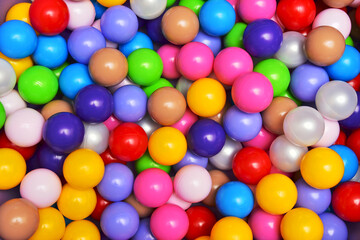 Fototapeta na wymiar Balls of different colors background children's dry pool
