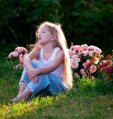 beautiful girl in garden with roses