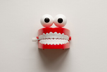 Eyes and teeth toy on white background