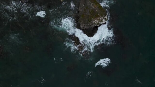 waves crashing on the island	
