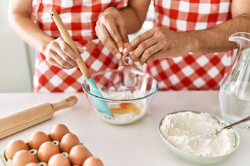 Cook hands mixing ingredients to make dough for homemade bread at kitchen.