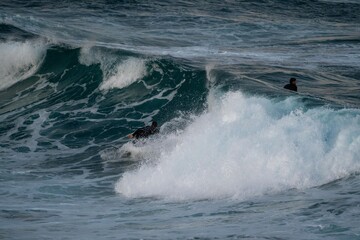 surfer catching a wave
