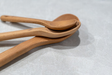 wooden spoons on a modern marble kitchen bench