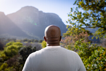 Back view of african american senior man looking into distance