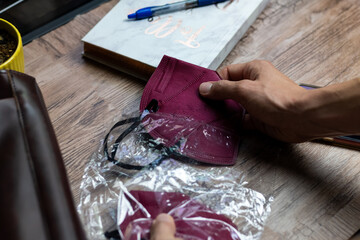 Desktop with face masks on top and office elements