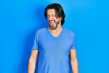 Obraz premium Middle age caucasian man wearing casual clothes winking looking at the camera with sexy expression, cheerful and happy face.