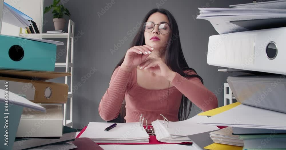 Wall mural Tired businesswoman with a lot of paperwork in office