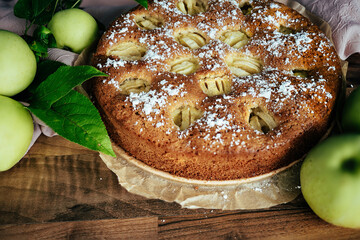 Apple pie decorated with fresh apples fruit.