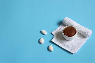 Spa composition with natural scrub and face towel, copy space.