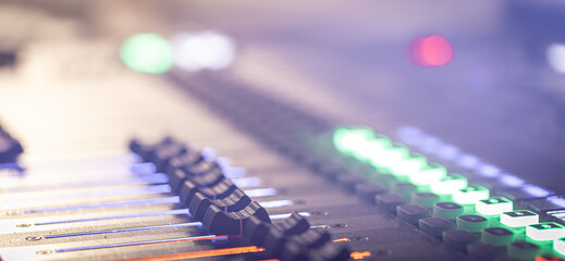 Naklejka na ściany i meble Close up, sound music mixer control panel on blurred background.