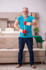 Old man doing plumbing at home