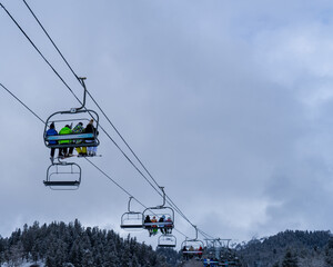 Image of a chair lift at a ski resort.