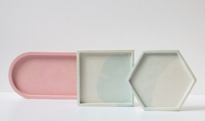 Podiums made of plaster, concrete. Background for perfumery, jewelry and cosmetic products.