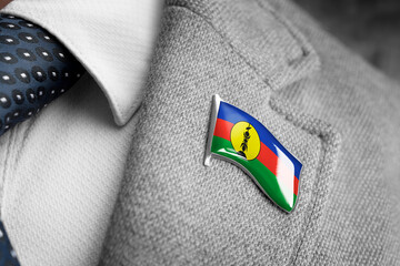 Metal badge with the flag of New Caledonia on a suit lapel