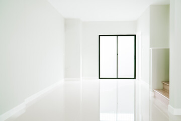 White empty room Interior with marble tile floors, glass doors and wooden stairs. Modern standard style. bright tone. soft focus. copy space for text.