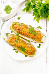 Cucumber stuffed with meat and vegetables on board top