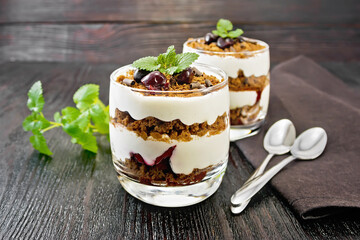 Dessert Black Forest in two glasses on wooden board