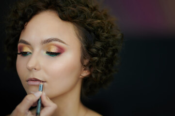 Fototapeta premium Making lines on woman lips
