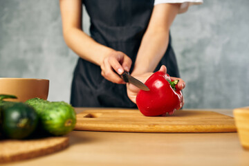 Woman in black apron Cooking healthy eating cutting board