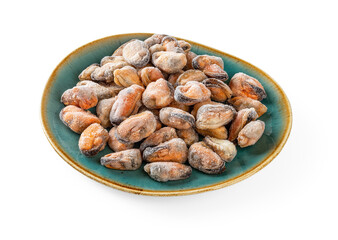 Frozen peeled mussel meat on an oval teal ceramic plate isolated on a white background. Cooked mussels as ingredient of omega-3 protein healthy eating and tasty seafood recipes. Ised shellfish.