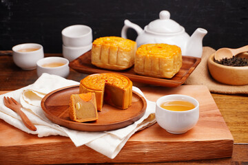Mooncakes Stir Fried Durian Filling with Salted Egg Yolk and hot tea Asian Festival