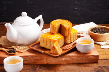 Mooncakes Stir Fried Durian Filling with Salted Egg Yolk and hot tea Asian Festival