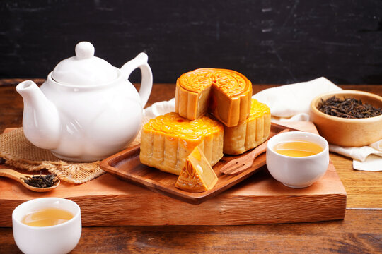 Mooncakes Stir Fried Durian Filling with Salted Egg Yolk and hot tea Asian Festival