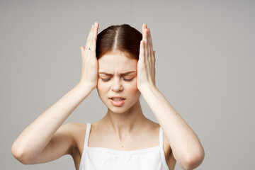 Fototapeta premium woman in white t-shirt headache health problems stress isolated background