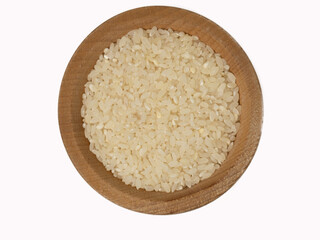 raw rice in wooden bowl on isolated white background