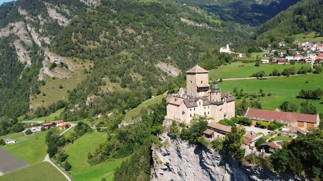 Aerial drone footage of the Ortenstein castle on a hilltop near Thusis in Canton Graubunden in the alps in Switzerland
