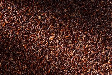 Uncooked Brown Rice Grain Background. Top Down View