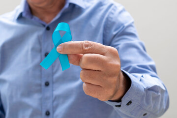 man holding blue ribbon. Blue november. Prostate Cancer Prevention Month. Men's health.