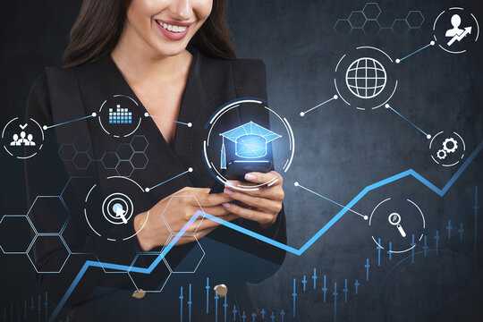 Smiling young educational consultant researching master degree programs in business administration, postgraduate level. Research of the best ranking university in the world. Hologram icons