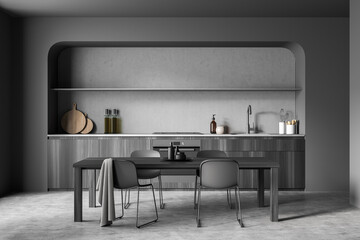 Minimalist dark grey kitchen with slim chairs and rounded niche