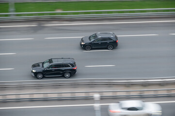 the car goes fast along the road.  movement and speed.  the rhythm of the city, the flow of time and business.  design of a booklet, album, website.