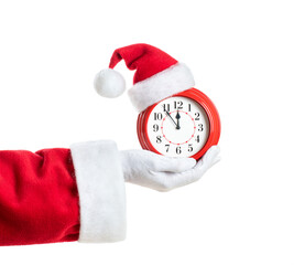 Santa Claus hand holding red alarm clock in Santa hat. Isolated on white background. Concept of...