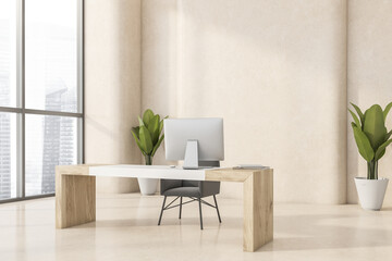 Minimalist tone-on-tone beige office. Corner view.