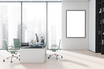 Canvas on white wall of manager office with green rolling chairs